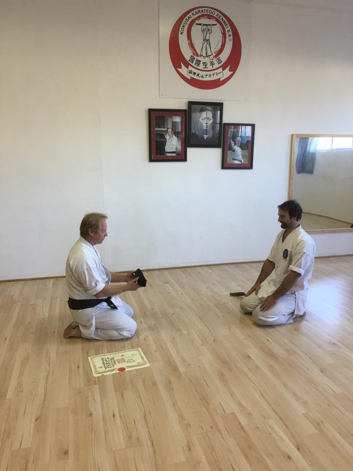 receiving 1st Dan Black Belt